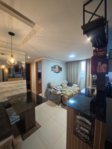 Quarto em apartamento mobiliado